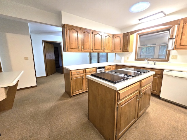 kitchen featuring black electric cooktop, light colored carpet, dishwasher, and a kitchen island