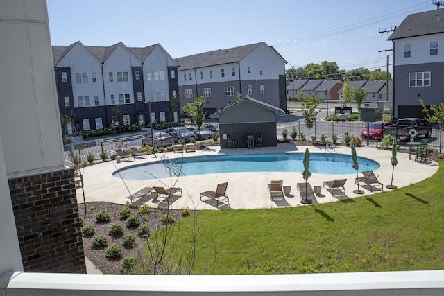 view of pool featuring a yard and a patio area