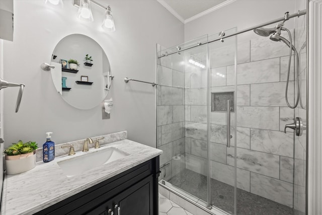 bathroom featuring ornamental molding, a shower stall, and vanity