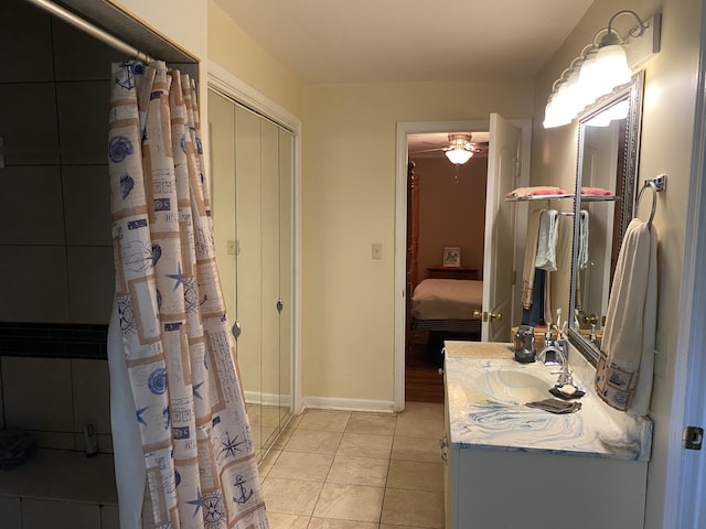 bathroom with ceiling fan, tile patterned flooring, vanity, and a shower with curtain