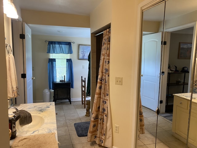 bathroom with tile patterned flooring and vanity