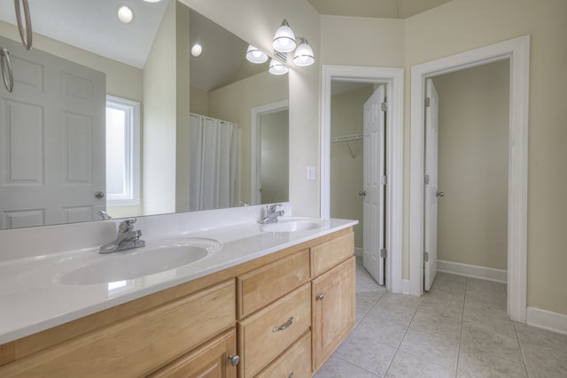 bathroom with vanity and tile patterned floors