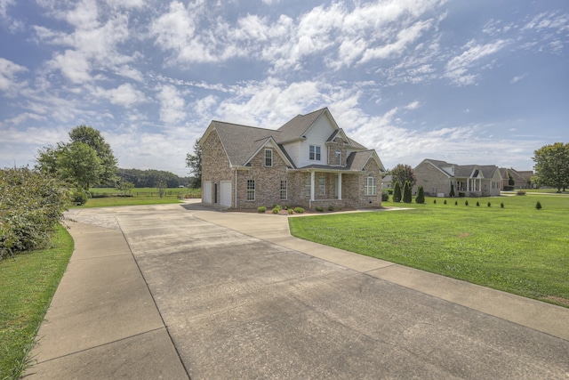 view of front of house with a front lawn and a garage