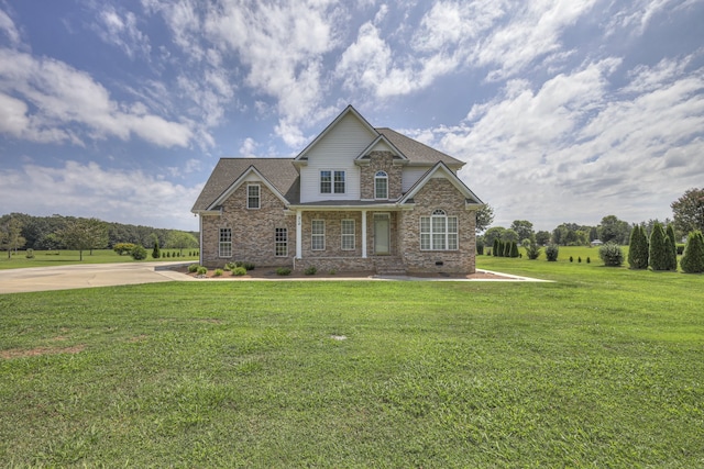 craftsman inspired home with a front lawn