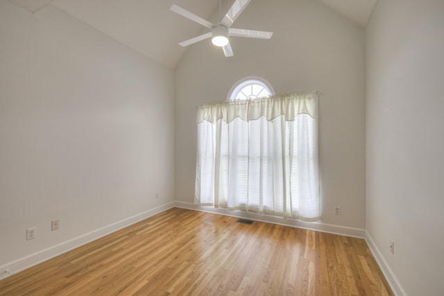 unfurnished room with light hardwood / wood-style floors, high vaulted ceiling, and ceiling fan