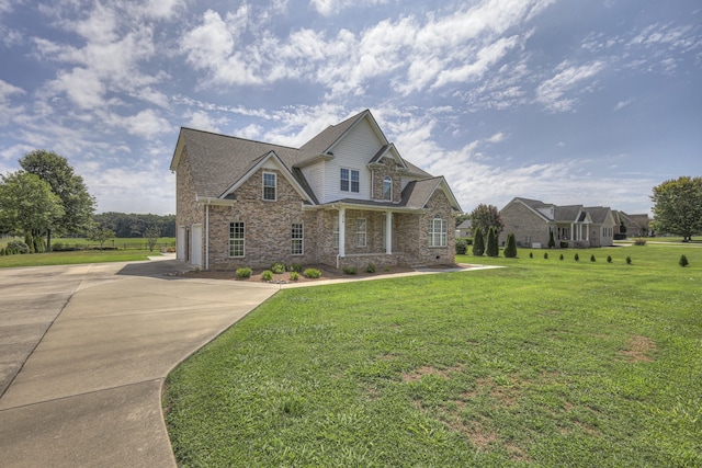 view of front facade with a front lawn and a garage