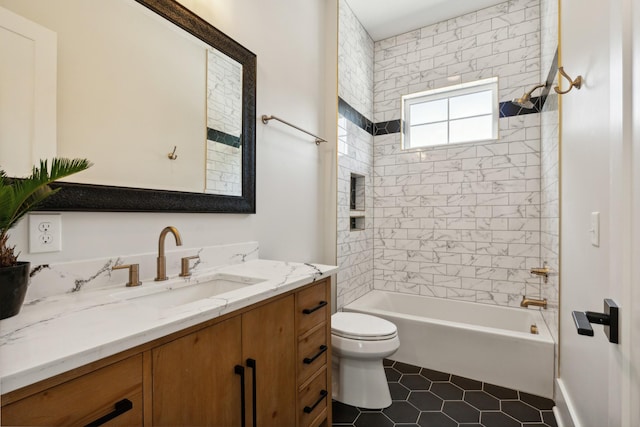 bathroom featuring toilet, shower / bathing tub combination, tile patterned flooring, and vanity