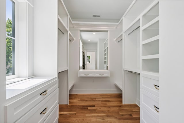 walk in closet with dark wood-type flooring and visible vents