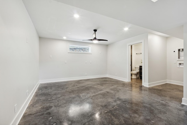 empty room with finished concrete flooring, baseboards, a ceiling fan, and recessed lighting