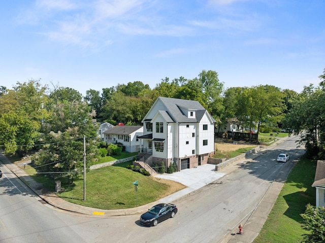 view of front of house with stairway and a front yard