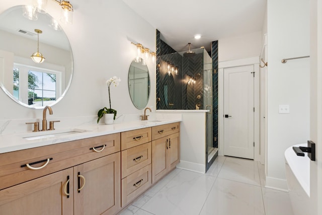 bathroom with double vanity, a stall shower, visible vents, marble finish floor, and a sink