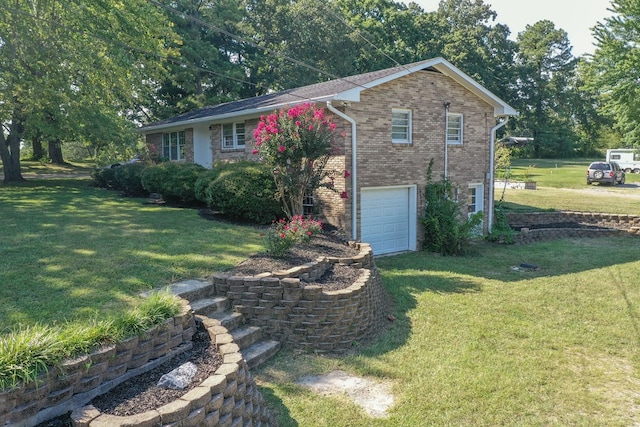 view of home's exterior with a yard and a garage