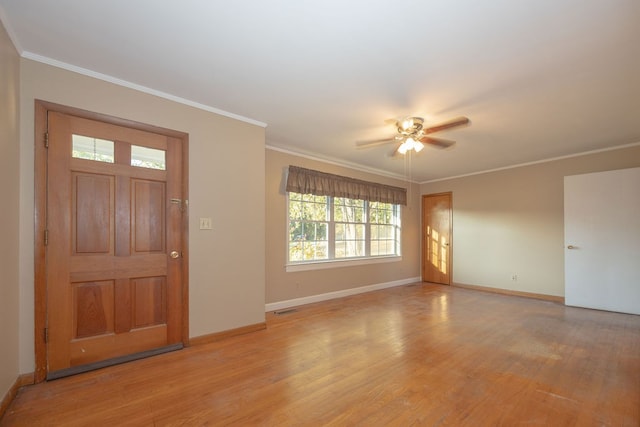 foyer entrance with ceiling fan, light hardwood / wood-style floors, and ornamental molding