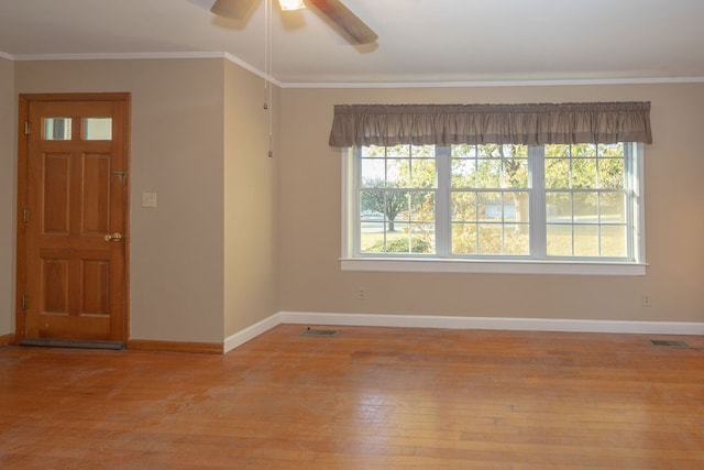 interior space featuring ceiling fan, light hardwood / wood-style flooring, and ornamental molding