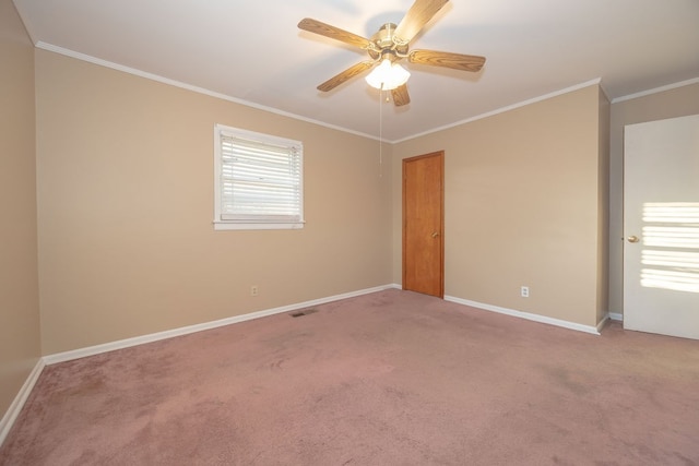 unfurnished room with carpet floors, ceiling fan, and ornamental molding