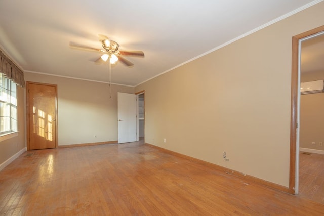 unfurnished room with ceiling fan, light hardwood / wood-style floors, a wall mounted air conditioner, and ornamental molding