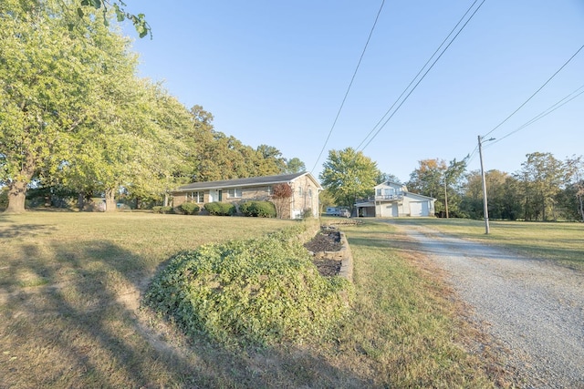 view of front of house with a front yard and a garage