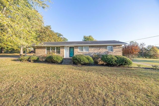 ranch-style home with a front lawn