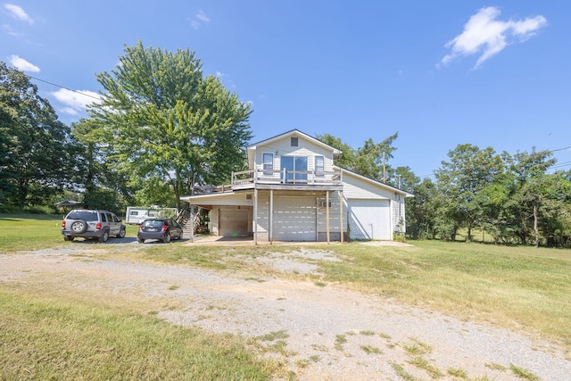 view of front property featuring a front yard and a garage