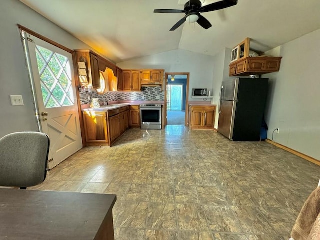 kitchen with backsplash, stainless steel appliances, ceiling fan, and lofted ceiling