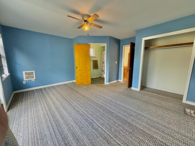 unfurnished bedroom featuring carpet flooring, ceiling fan, and a closet