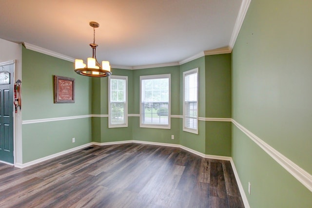 unfurnished room with crown molding, an inviting chandelier, and dark hardwood / wood-style floors