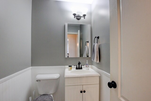 bathroom featuring toilet and vanity