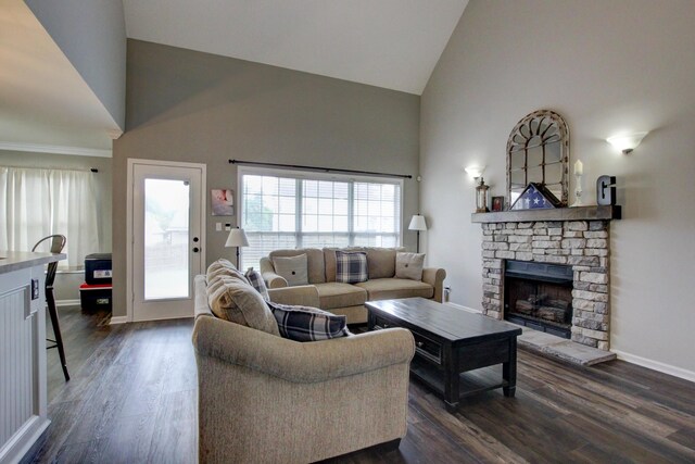 living room featuring a fireplace, high vaulted ceiling, and dark wood-type flooring