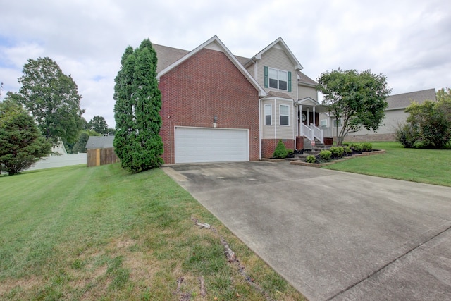 view of front facade with a garage and a front lawn