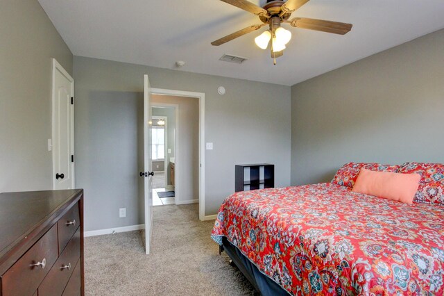 bedroom featuring ceiling fan and light carpet