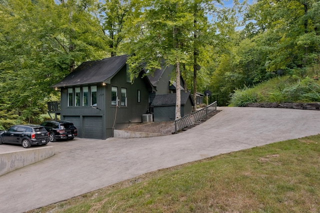 view of side of property featuring a garage