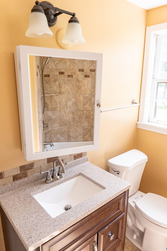 full bath with toilet, shower / washtub combination, and vanity