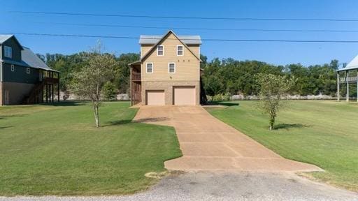 view of home's exterior with a garage, concrete driveway, and a yard