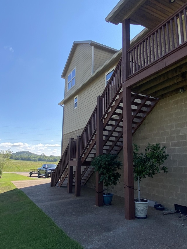 view of home's exterior with stairway