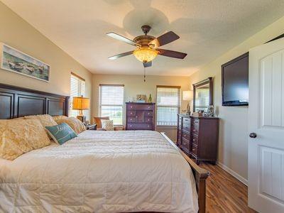 bedroom featuring ceiling fan, wood finished floors, and baseboards