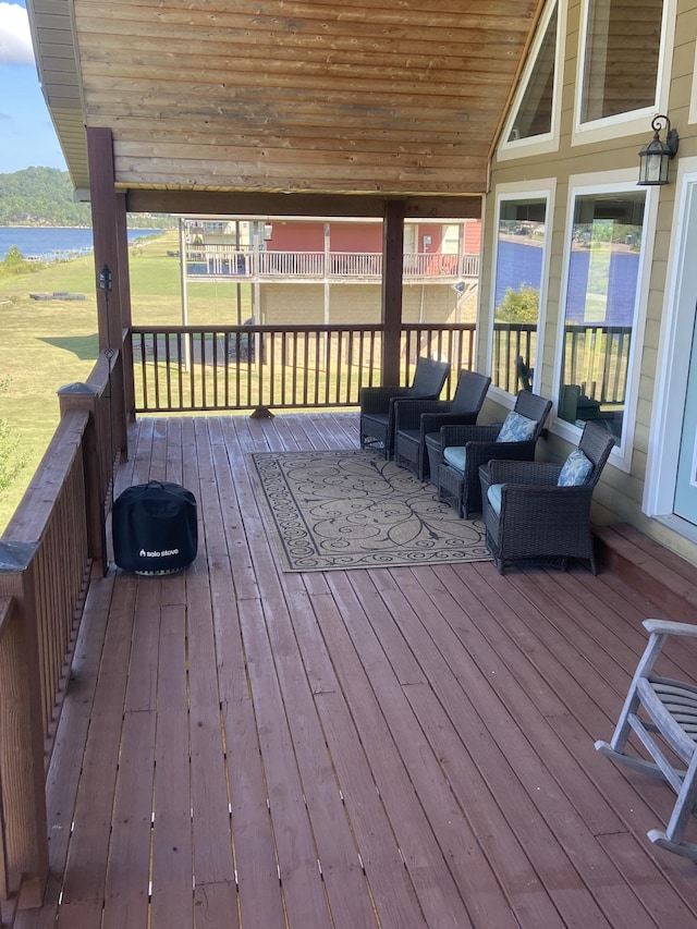 deck featuring a water view