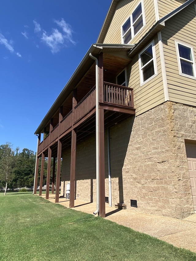 view of home's exterior featuring a patio area and a lawn