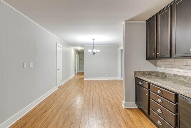 kitchen with backsplash, an inviting chandelier, light hardwood / wood-style flooring, dark brown cabinets, and hanging light fixtures