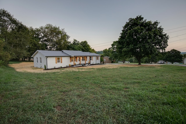 view of front of home with a yard