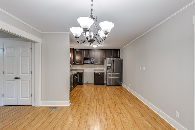 kitchen featuring decorative light fixtures, a chandelier, tasteful backsplash, stainless steel refrigerator with ice dispenser, and light wood-type flooring