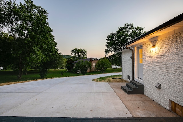 view of patio terrace at dusk