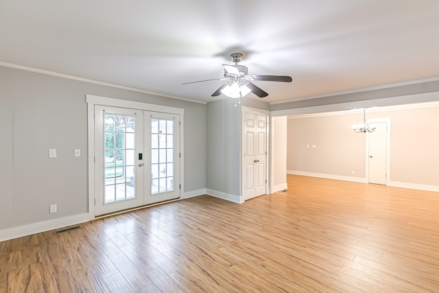 unfurnished room featuring ceiling fan, ornamental molding, light hardwood / wood-style flooring, and french doors