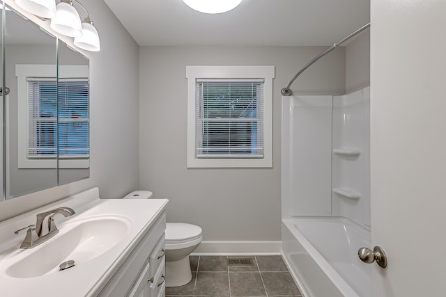 full bathroom with tile patterned floors, vanity, shower / tub combination, and toilet