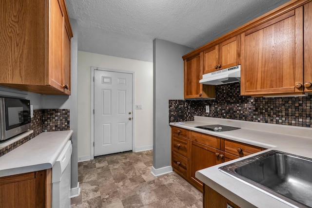 kitchen with stainless steel microwave, black electric stovetop, tasteful backsplash, tile patterned flooring, and dishwasher