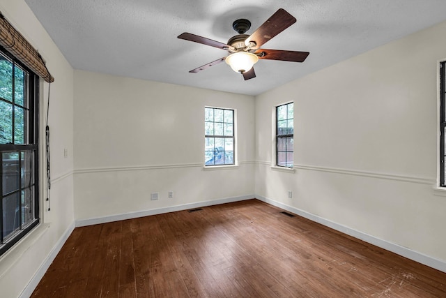 unfurnished room featuring ceiling fan, a textured ceiling, and wood-type flooring