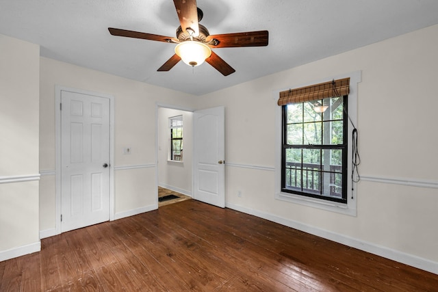 unfurnished bedroom featuring hardwood / wood-style flooring and ceiling fan