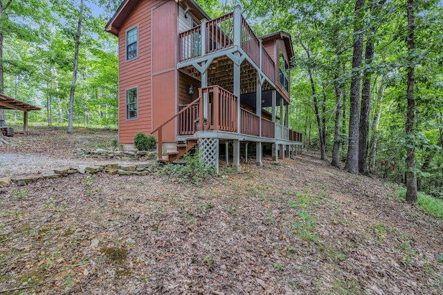 view of side of property with a deck