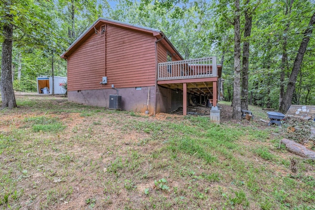 rear view of house with a wooden deck