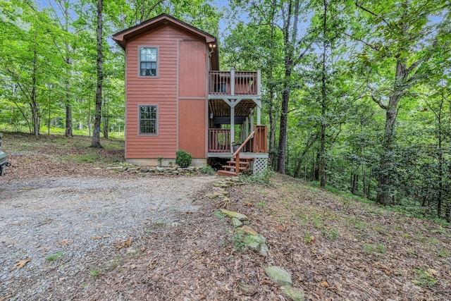 back of house with a balcony