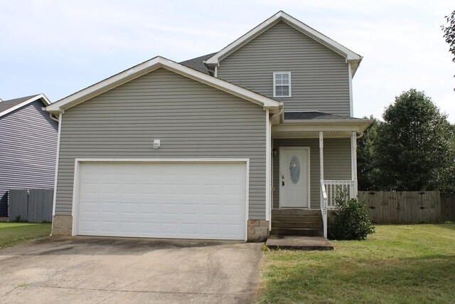 view of front of property with a garage and a front yard